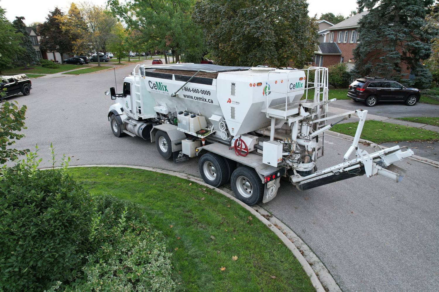 CeMix Concrete Limited volumetric mobile concrete truck parked on a residential street in Grimsby Ontario for on-site concrete mixing. 